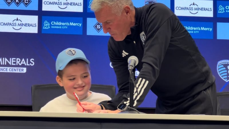 Miles Smith signs with Sporting KC on Oct. 3, 2024.