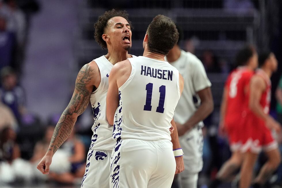 Kansas State guard Max Jones celebrates with Kansas State guard Brendan Hausen (11) after...