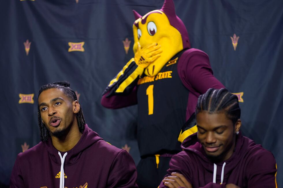 Arizona State's Adam Miller, left, and Alston Mason, right, talk to the media during the NCAA...