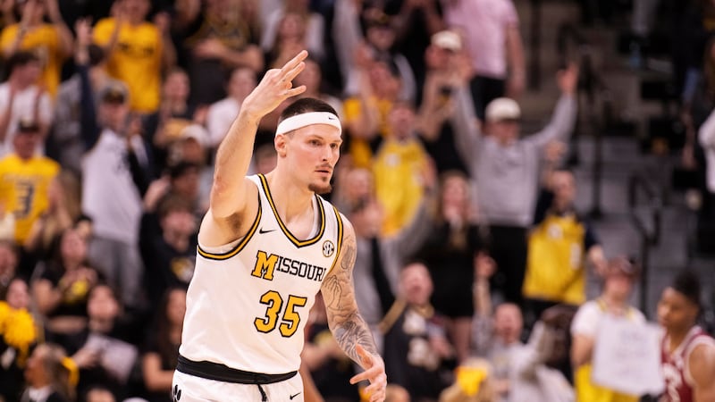 Missouri's Jacob Crews celebrates a 3-point basket during the first half of an NCAA college...