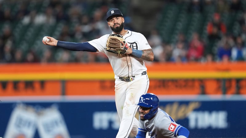 Detroit Tigers second baseman Gleyber Torres throws to first base to complete a double play as...