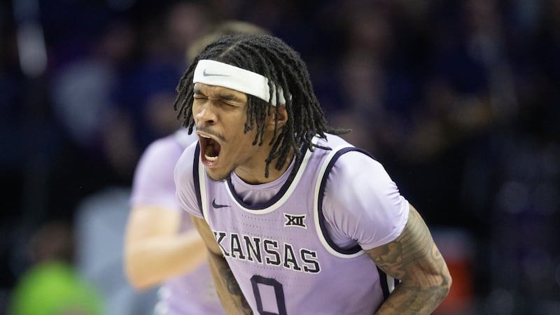 Kansas State's Dug McDaniel celebrates a play during the second half of an NCAA college...
